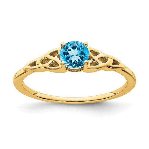 14K gold blue topaz Celtic knot ring with intricate design, crafted by Solomon Jewelers.