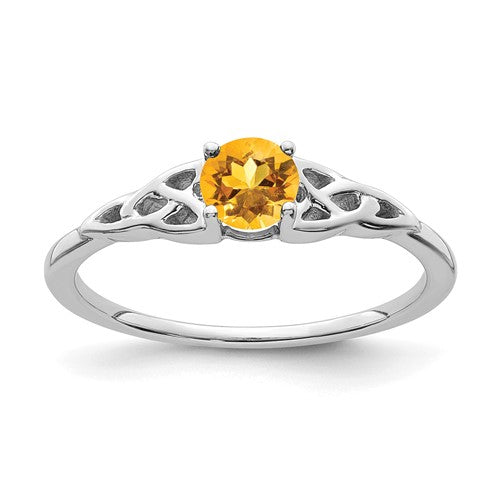 14K white gold Celtic knot ring with a vibrant citrine gemstone, crafted by Solomon Jewelers, detailed close-up of the jewelry.