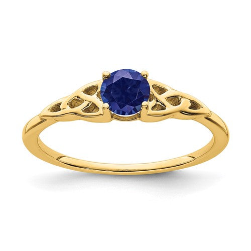14K created sapphire Celtic knot ring from Solomon Jewelers, showcasing intricate design and vibrant blue gemstone.