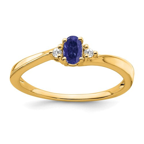 14K gold sapphire and diamond ring from Solomon Jewelers featuring a central blue sapphire and sparkling diamonds.