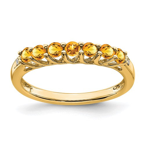 14k gold citrine and diamond 7-stone ring featuring a gold band and sparkling gemstones, designed by Solomon Jewelers.