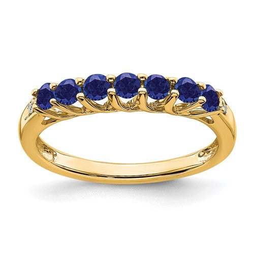14k gold created sapphire and diamond 7-stone ring with elegant design, featuring sparkling gemstones and intricate craftsmanship.