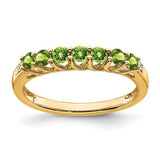 14k gold peridot and diamond 7-stone ring featuring vibrant green gemstones and sparkling accents, elegant jewelry by Solomon Jewelers