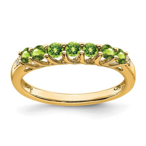 14k gold peridot and diamond 7-stone ring featuring vibrant green gemstones and sparkling accents, elegant jewelry by Solomon Jewelers