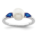14k white gold pearl and sapphire ring with intricate detailing, featuring a central pearl and blue sapphires from Solomon Jewelers.