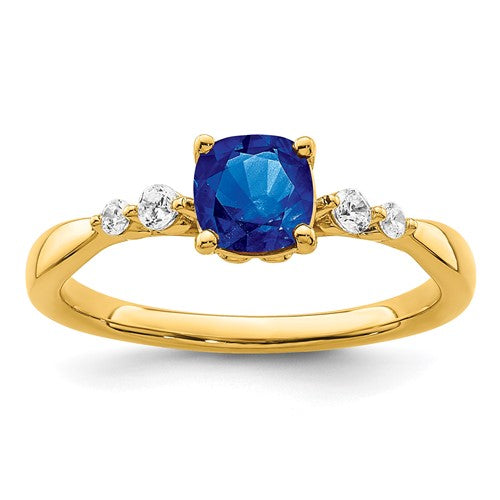 14k gold ring featuring polished sapphires and diamonds, elegant jewelry piece from Solomon Jewelers.