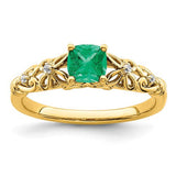 14k gold polished emerald and diamond ring featuring a central emerald gemstone with diamond accents, elegant jewelry from Solomon Jewelers.