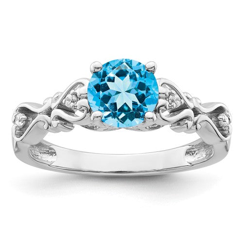 14k white gold ring with polished blue topaz and diamond accents, elegant jewelry piece featuring sparkling gemstones.