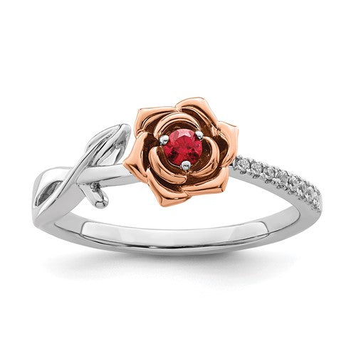 14K two-tone white and rose gold flower ring with rubies and diamonds, showcasing intricate jewelry craftsmanship.