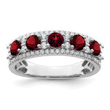 14k white gold garnet and diamond ring with polished finish, featuring a vibrant garnet stone and sparkling diamonds.