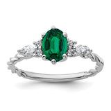 14K white gold twisted ring with polished finish featuring diamonds and lab-created emeralds, jewelry by Solomon Jewelers.