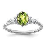 14K white gold twisted ring with polished finish, featuring diamonds and peridot gemstones, designed by Solomon Jewelers.
