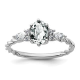 14K white gold twisted ring with polished finish, featuring diamonds and white topaz accents, from Solomon Jewelers.