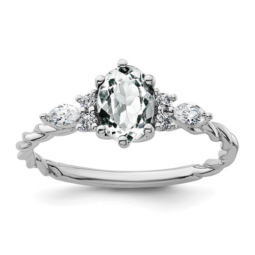 14K white gold twisted ring with polished finish, featuring diamonds and white topaz accents, from Solomon Jewelers.