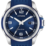 Citizen Eco-Drive watch with a textured blue dial, silver-tone stainless steel case, and a blue perforated silicone strap, shown on a white background.