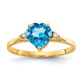 14k gold ring with a 7mm heart-shaped blue topaz and AA diamond accents, elegant jewelry from Solomon Jewelers.