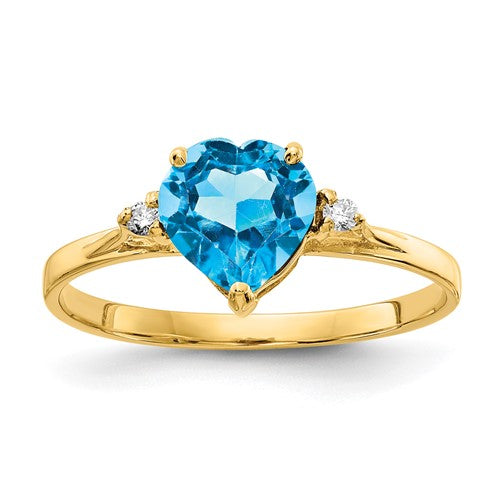 14k gold ring with a 7mm heart-shaped blue topaz and AA diamond accents, elegant jewelry from Solomon Jewelers.