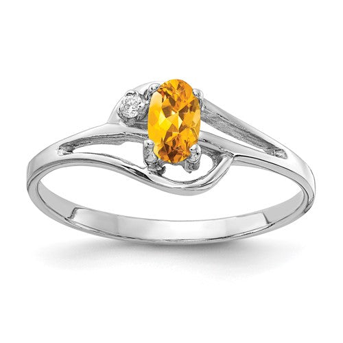 14k white gold ring featuring a 5x3mm oval citrine and AA diamond accents, showcasing elegant jewelry craftsmanship.
