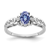 14k white gold ring with 6x4mm oval tanzanite and AA diamonds, elegant jewelry piece from Solomon Jewelers