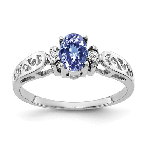 14k white gold ring with 6x4mm oval tanzanite and AA diamonds, elegant jewelry piece from Solomon Jewelers