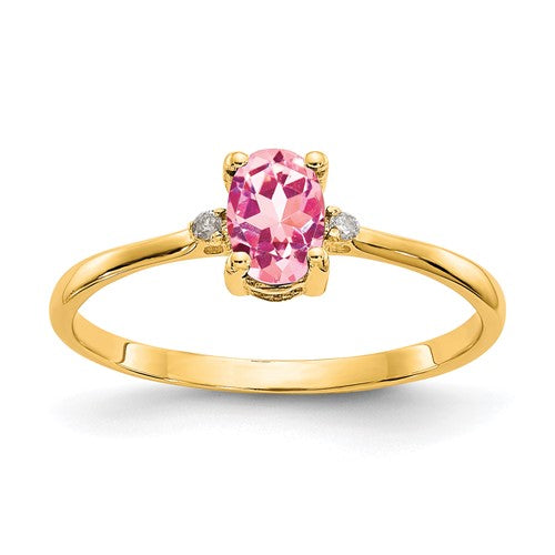 14k gold diamond and pink tourmaline birthstone ring with intricate design, showcasing sparkling gemstones and fine craftsmanship.