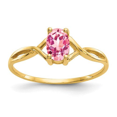14k pink tourmaline birthstone ring featuring a vibrant pink gemstone set in a gold band, crafted by Solomon Jewelers.