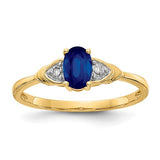14k gold sapphire and diamond ring featuring a central blue sapphire and sparkling diamonds, designed by Solomon Jewelers.