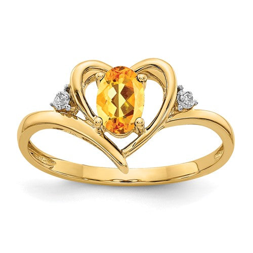 14k gold citrine and diamond heart ring, elegant jewelry piece with yellow gemstone and sparkling diamonds.