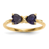 14k gold polished created sapphire bow ring from Solomon Jewelers, featuring a shiny gold band with a blue sapphire bow design.