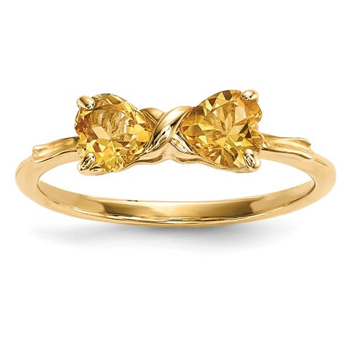 14k gold polished citrine bow ring from Solomon Jewelers, featuring a shiny gold band with a vibrant citrine gemstone.