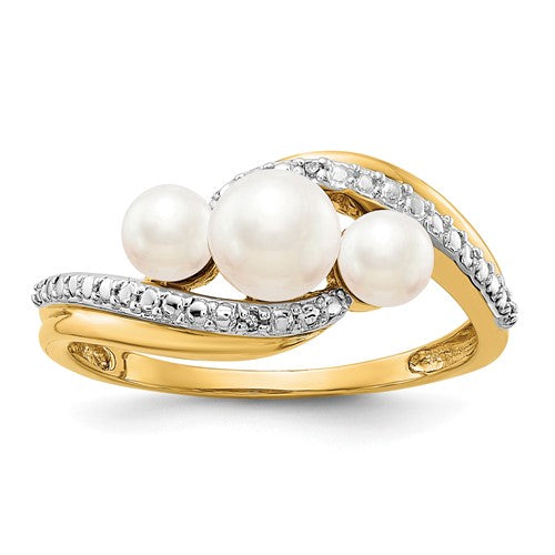 14k gold diamond and faux cultured pearl bypass ring with three pearls, crafted by Solomon Jewelers.