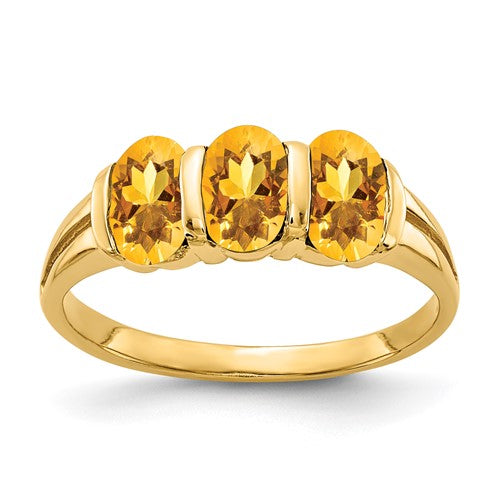 14k gold oval citrine ring with 6x4mm gemstone, elegant jewelry piece featuring a polished gold band.