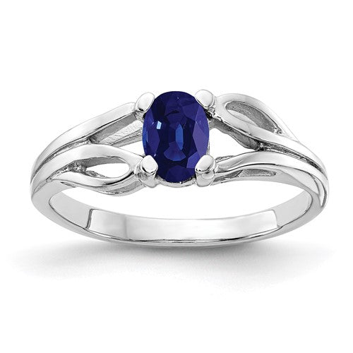 14k white gold oval sapphire ring with a 6x4mm center stone, elegant jewelry piece from Solomon Jewelers.