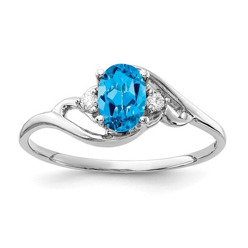 14k white gold ring featuring a 6x4mm oval blue topaz and AA quality diamonds, crafted by Solomon Jewelers.