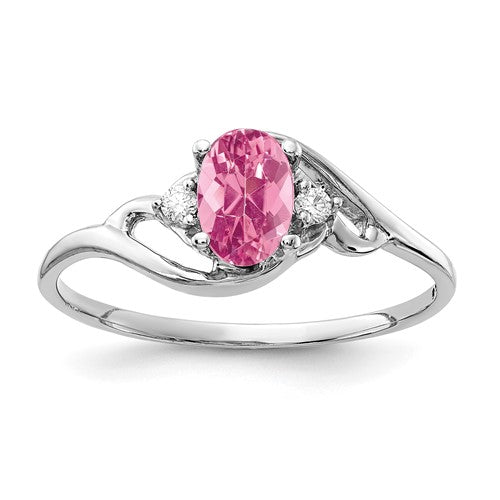 14k white gold ring featuring a 6x4mm oval pink tourmaline and AAA diamonds, crafted by Solomon Jewelers.