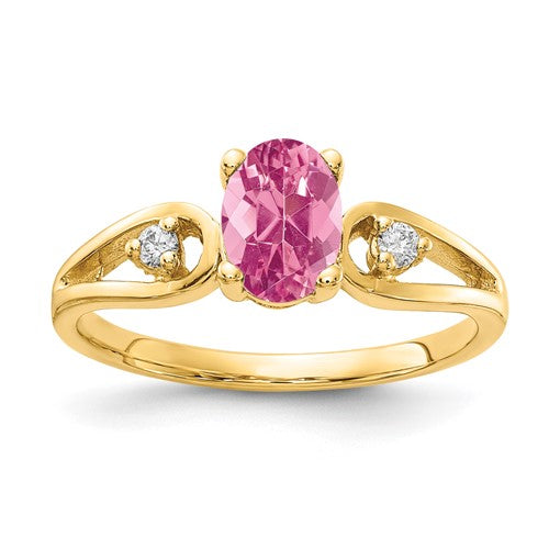 14k gold ring featuring a 7x5mm oval pink tourmaline and AA-grade diamonds, elegant jewelry by Solomon Jewelers.
