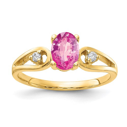 14k gold ring with 7x5mm oval pink sapphire and AA diamond accent, elegant jewelry ring from Solomon Jewelers
