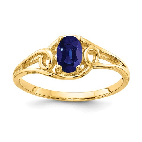 14k gold oval sapphire ring with 6x4mm gemstone, elegant jewelry piece featuring a polished band and vibrant blue sapphire.