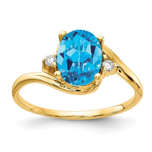 14k gold blue topaz and diamond ring featuring a central blue topaz gemstone and sparkling diamonds, elegant jewelry ring.