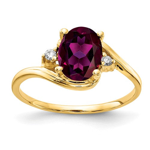 14k gold ring featuring an 8x6mm oval Rhodolite Garnet and AA diamonds, crafted by Solomon Jewelers.