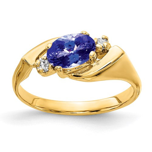 14k gold oval Tanzanite and AA diamond ring featuring a 7x5mm gemstone, elegant jewelry by Solomon Jewelers.