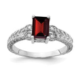 14k white gold ring featuring a 7x5mm garnet and AA diamonds, elegant jewelry piece from Solomon Jewelers.