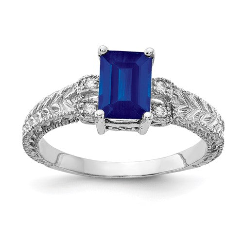 14k white gold sapphire and diamond ring with 7x5mm emerald cut sapphire and AA-grade diamonds by Solomon Jewelers