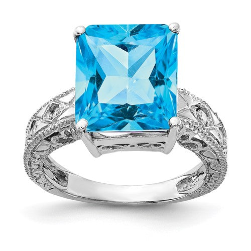 14k white gold ring featuring a 12x10mm emerald cut blue topaz with AAA diamonds, elegant jewelry by Solomon Jewelers