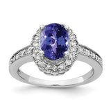 14k white gold ring with an 8x6mm oval tanzanite and AA diamond accents, elegant jewelry piece by Solomon Jewelers