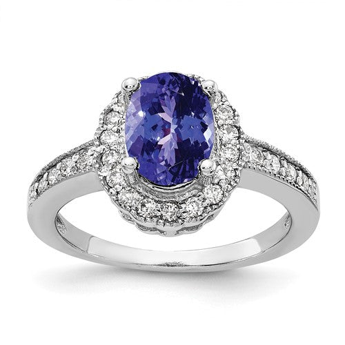 14k white gold ring with an 8x6mm oval tanzanite and AA diamond accents, elegant jewelry piece by Solomon Jewelers