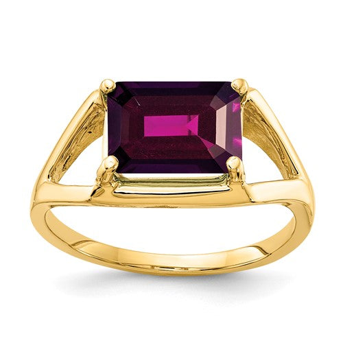 14k gold ring featuring a 9x7mm emerald cut Rhodolite garnet, elegant jewelry piece with a classic design.