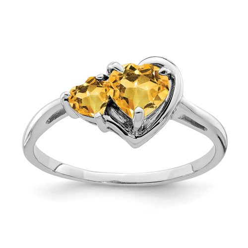 14k white gold gemstone ring featuring a sparkling central stone, elegant jewelry piece by Solomon Jewelers.