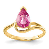 14k gold ring featuring a pear-shaped pink tourmaline gemstone, elegant jewelry piece from Solomon Jewelers.