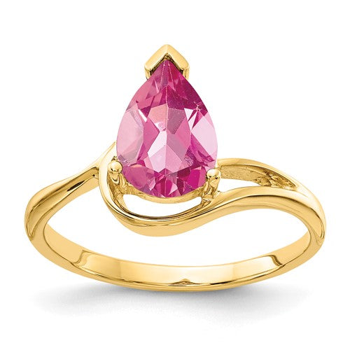 14k gold ring featuring a pear-shaped pink tourmaline gemstone, elegant jewelry piece from Solomon Jewelers.